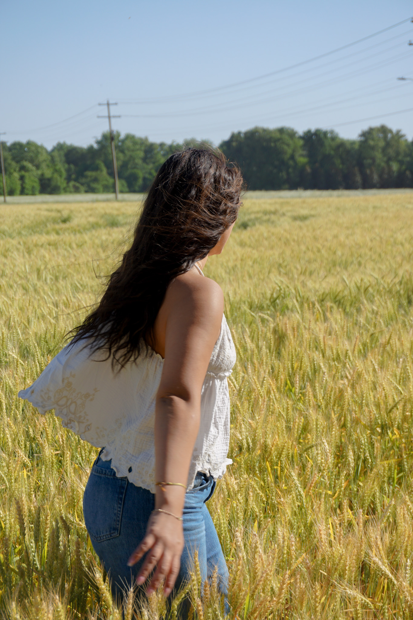 Josie Bryant walking through the Tennessee fields.