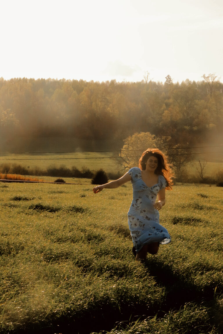 Chelsea Running Through Grass